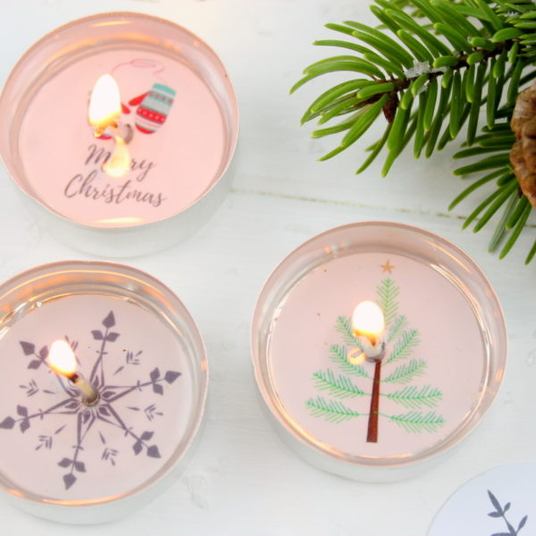 Teelichter mit weihnachtlichen Bildern und versteckter Botschaft